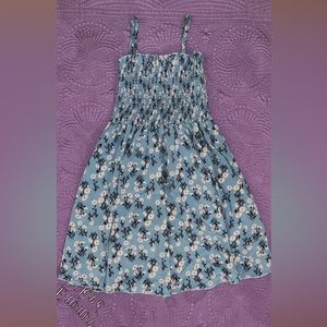 Small blue dress with white flowers pattern. Never been wore. Thigh length.